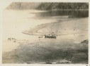 Image of Small boats, people at low tide